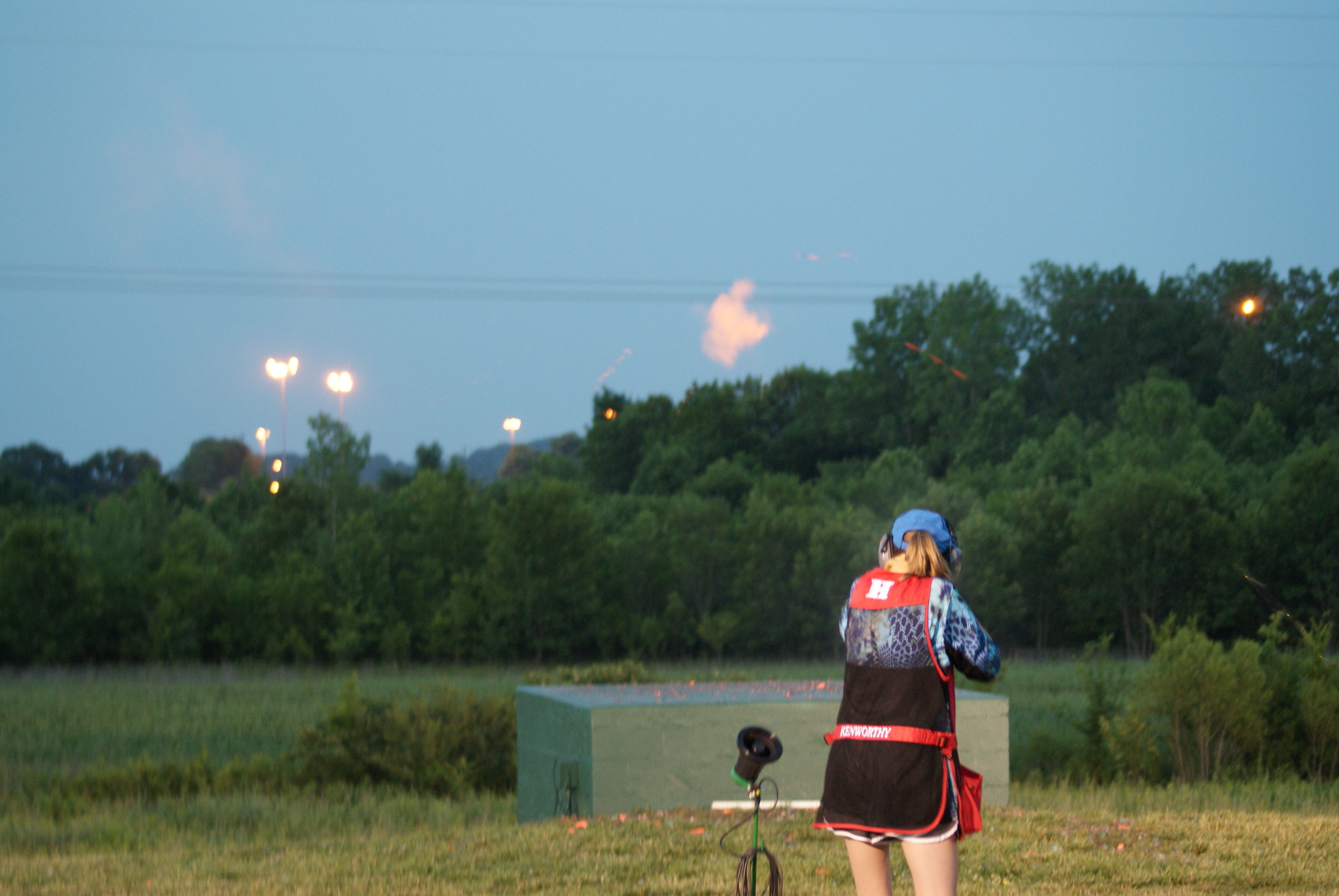 Brooke Kenworthy smashes a target under the lights in a shootoff for 3rd place.