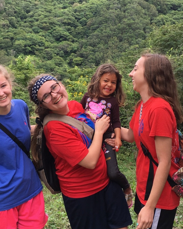 Our group spent a day in a remote village in the mountains. They assisted with a medical and dental clinic and held a VBS for the children. Here, Hannah Wright, Mallory Wyatt, and Deanna Hutson play with one of the children.