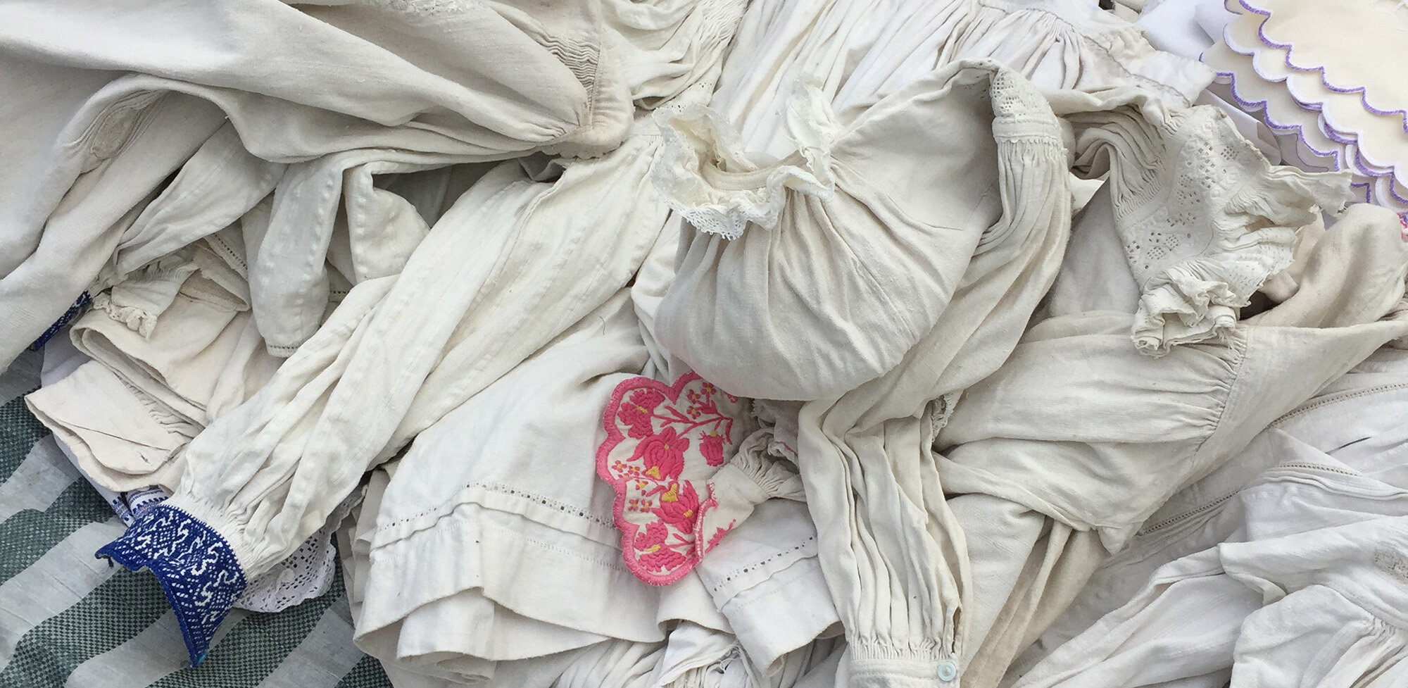 site-crop pile of white blouses Ro 14.jpg