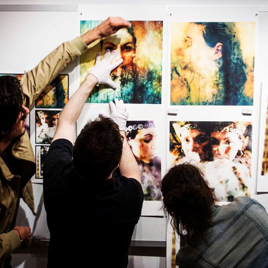 Classmate Vicente and mentor Tom helping me hang my prints for the final crit © 2013 Katrin Eismann