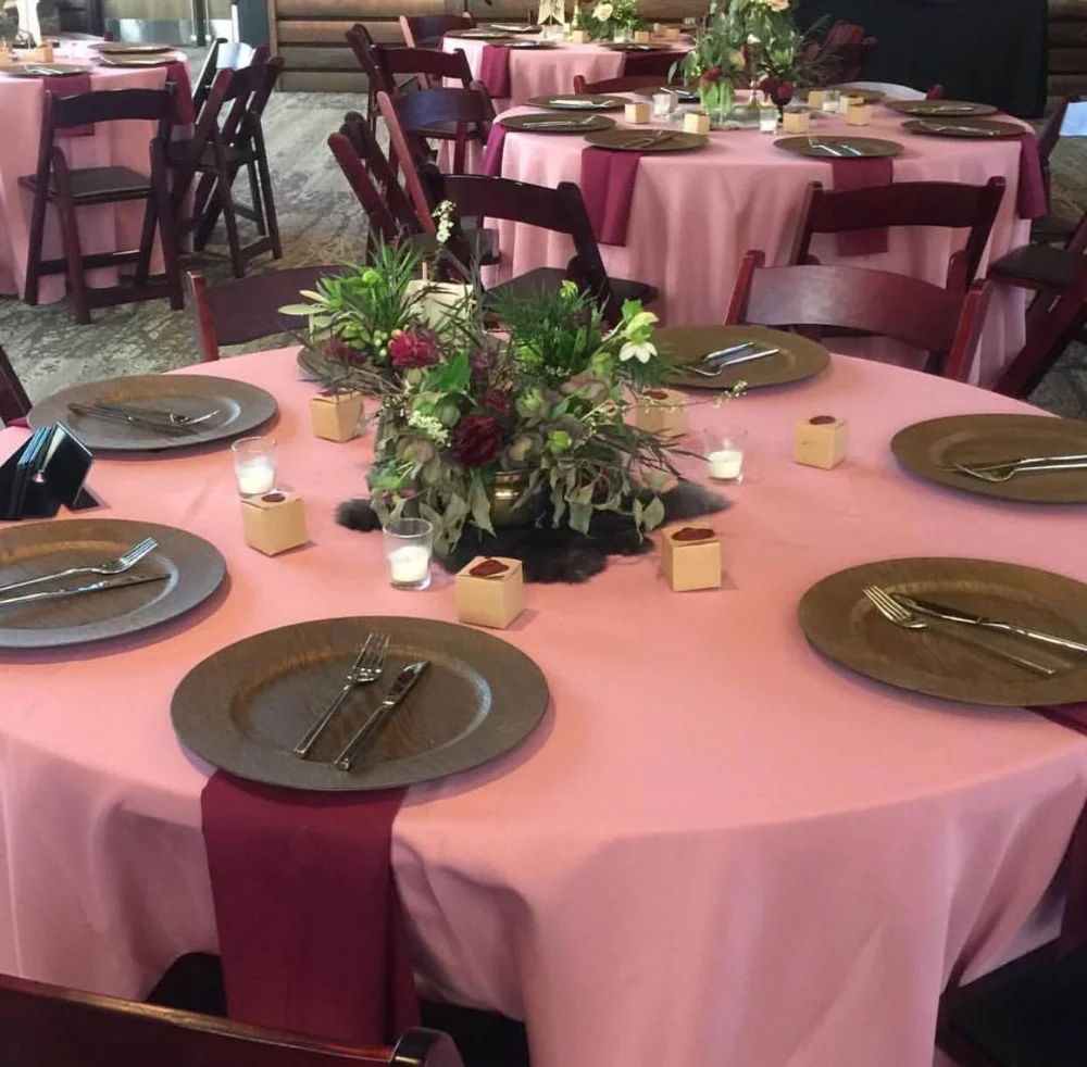 Table Setting- I love a colored table cloth rather than sticking to a traditional ivory. And I couldn't resist these wooden chargers!