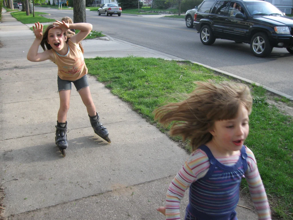Grace and Rain rollerblading the neighborhood.