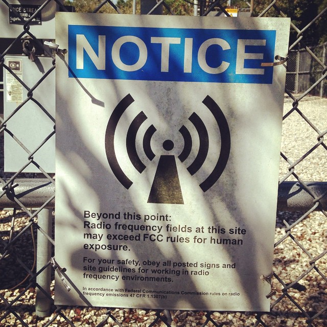 While__gifting_the_local_cell_phone_towers__found_this_sign_that_reads_Radio_Frequency_Fields_at_this_site_may_exceed_FCC_rules_for_human_exposure._This_particular_tower_was_located_between_two_homes__at_the_highest_peak_in_Florida._We_need_to_grasp_.jpg