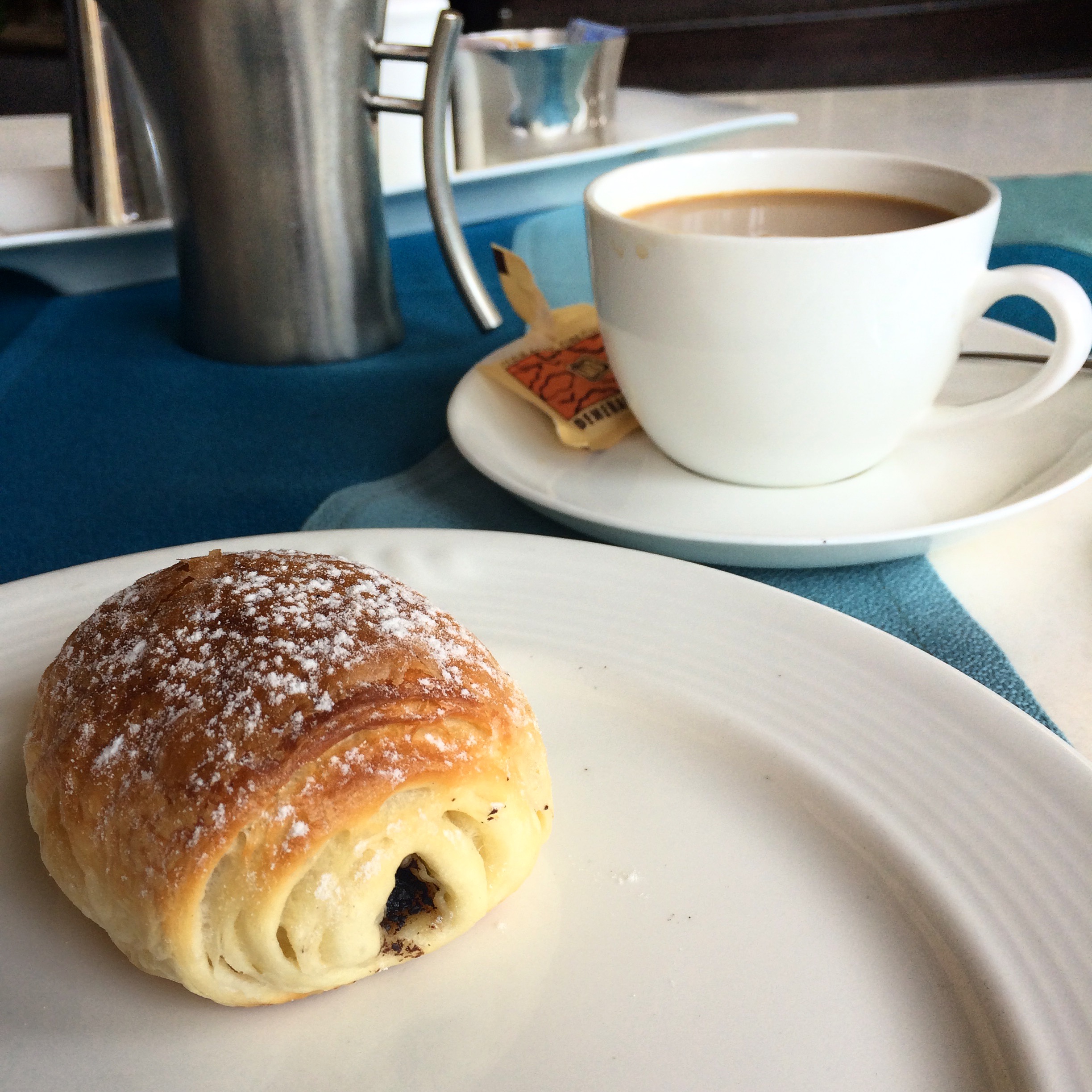 I spent one day entirely by myself -- table for one -- and enjoyed this delicious breakfast of coffee + a chocolate croissant.