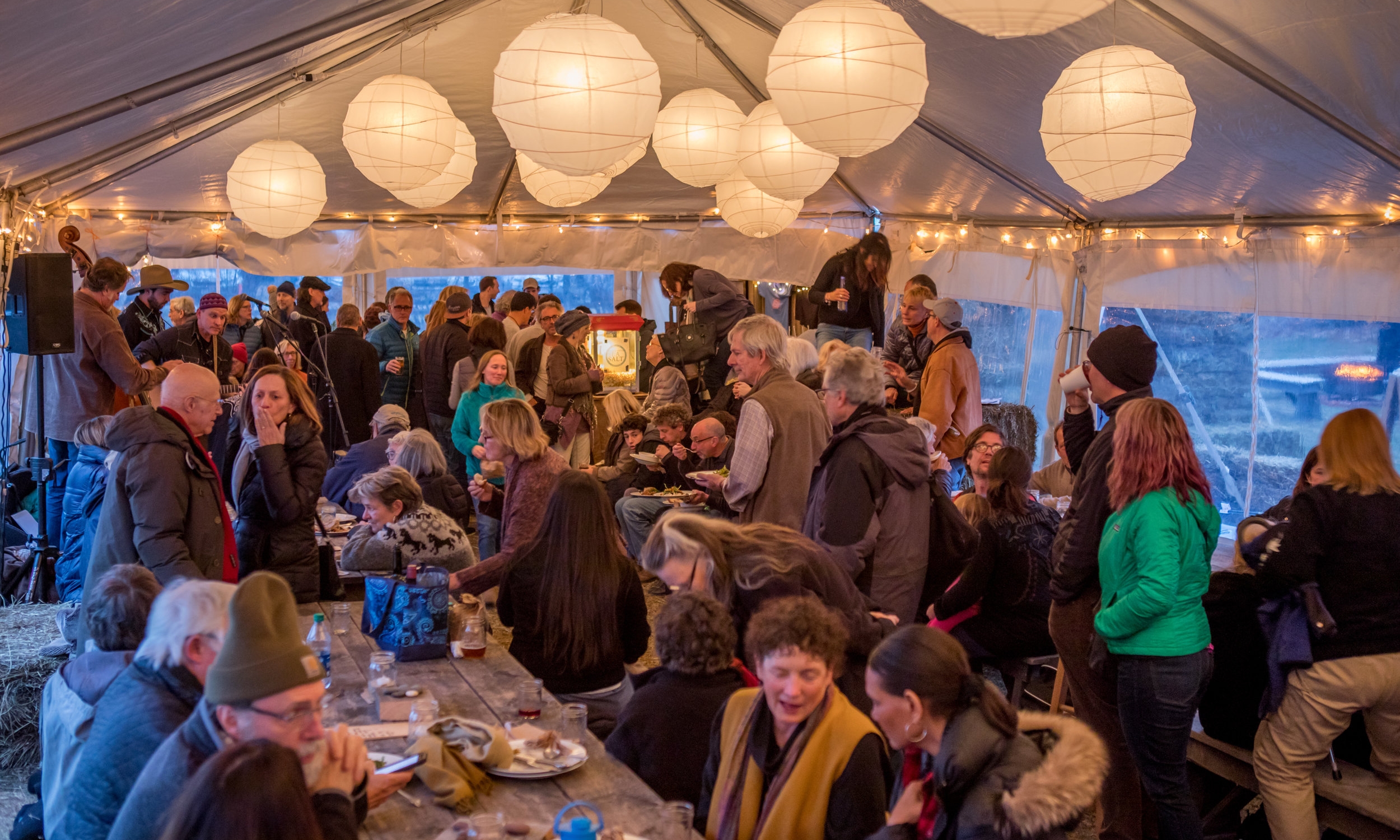 At our festival in March, you'll gather on hay bales and couches, and experience the magic of our community.