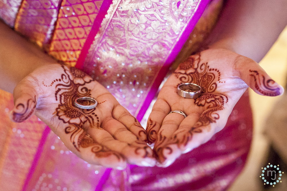 The bride's simple mehndi, glorious colorful sari and precious metals. 
