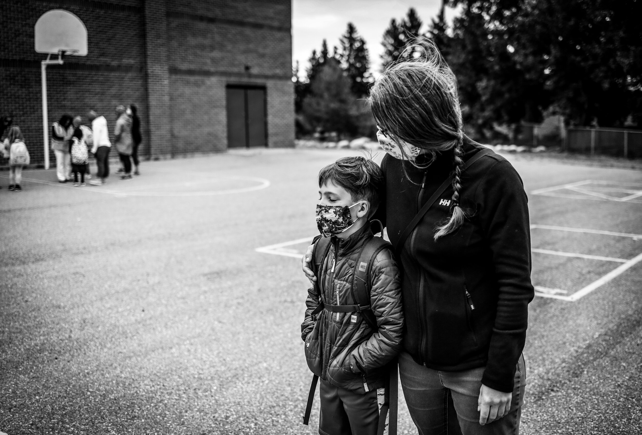  Karilynn Simpson waits with her son William on his first day back to school in Calgary, Alberta during the COVID-19 pandemic. 