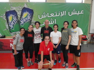 The team of “locals” who assisted in translation and coaching stand with Dennis Dye, the director of this sports camp.