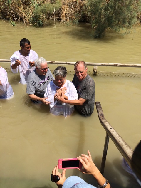Pastor Paul and Pastor John baptize me in the Jordan River.