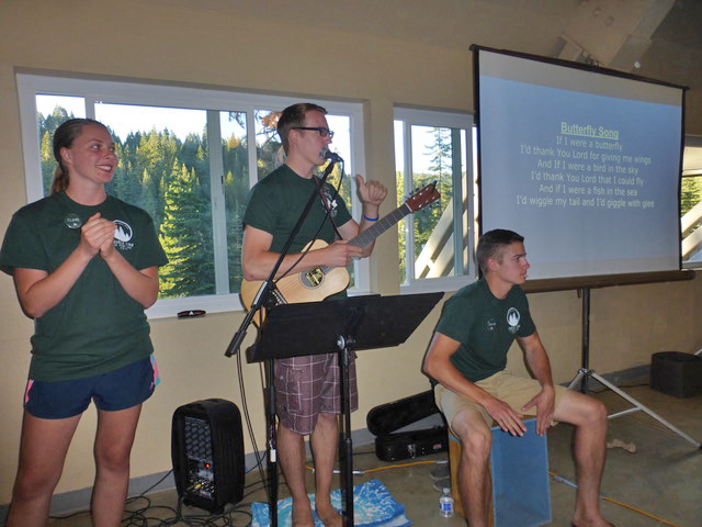 Claire, Robert, and Jacob lead “The Butterfly Song."