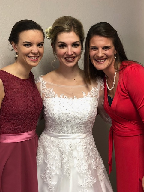 Katie Grieb and Lisa Friesen support Elsa on her special day.