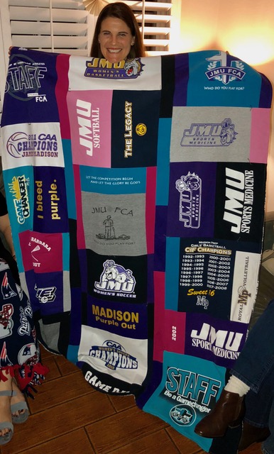 She loved her t-shirt quilt (and BTW, this is the first of several, as I used only a small portion of the t-shirts she has!).