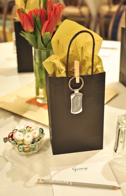 The “goodie bags” and vases of spring-fresh red tulips created an ambience of thoughtful consideration for each attendee.