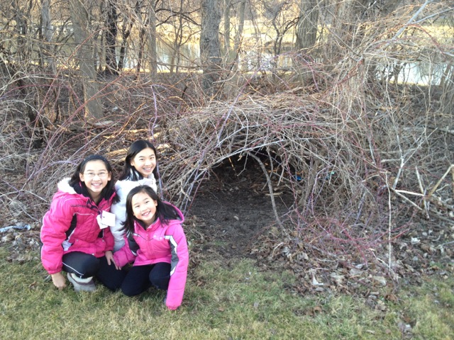 Jessica, Leilani, and Jasmine show us a fort they built in their spacious back yard.