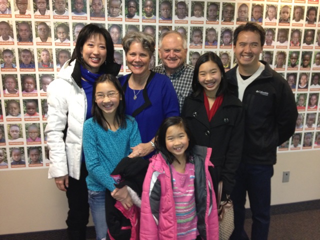 At church Sunday morning, we stood in front of the photo of their newly "adopted through support" African child.