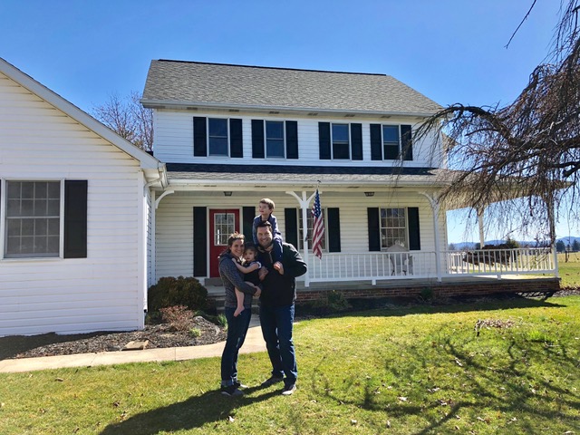 The final Johnson family photo in front of their first owned home.
