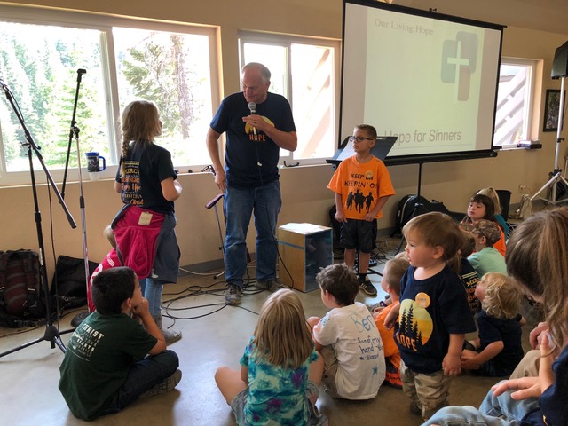 Paul leads the morning devotions for a very engaged group of young (and old) ones.