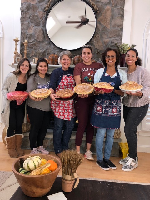 The Patriots wives proudly show the fruit of their labors.