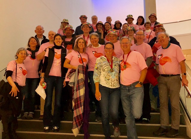 The "flock of flamingos” gather post scavenger hunt for a photo.