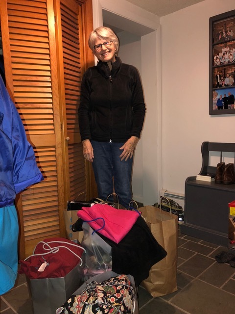 Helen standing by the bags of “culled” items.