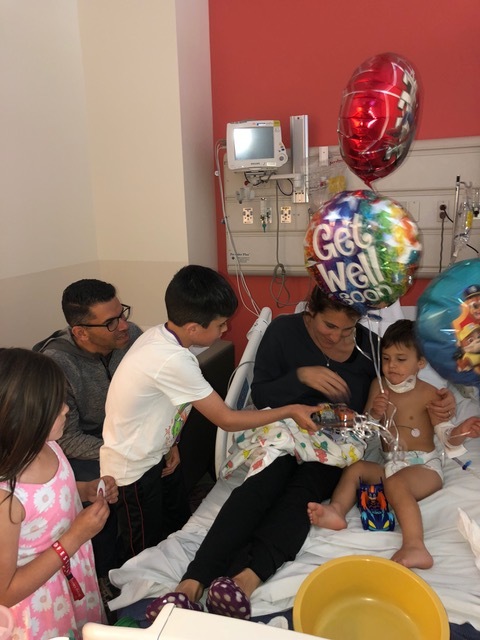 The next day, though, a hospital visit was in order and Micah was very happy to see his siblings.