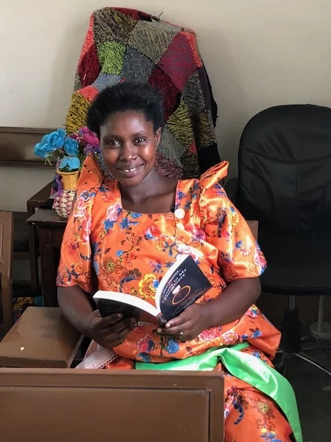 Some of those attending are fluent in English and were eager to get their hands on some of the resources we brought. This photo was not set up; I “caught” her reading Letters to my Daughters during the lunch break and asked her to smile for the camera. :-)
