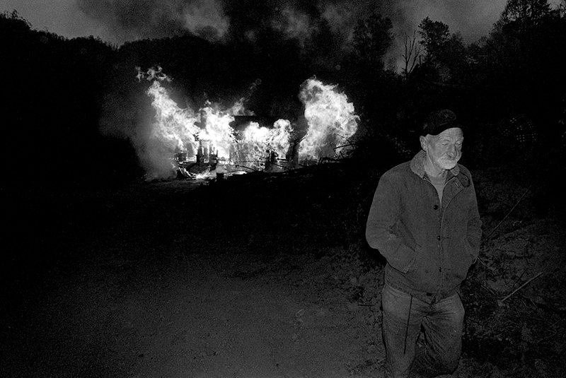   JD Thomas Walking Away from his Burning Home Place, Sprinkle Creek, NC – from The New Road  