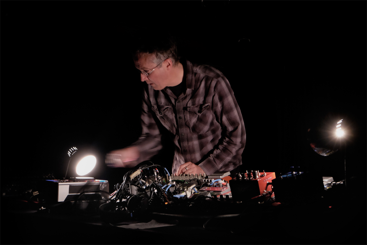 Mark Hosler pushing the buttons and turning the dials, Crystal Ballroom, Portland, Oregon, 2014