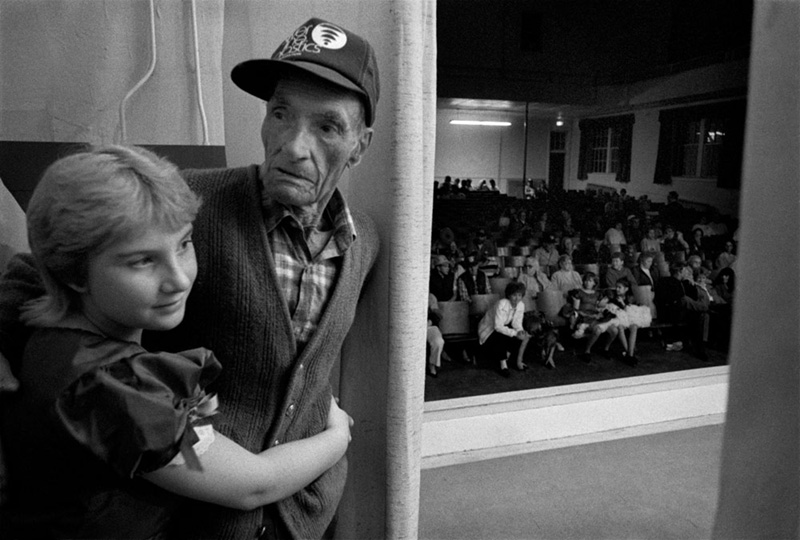 At the Democratic Party Fish Fry, Marshall, Madison County, NC 1990 This has long been one of my all-time favorite pictures. The way it moves. The moment in time. The gesture and posture. The audience. The framing. Loose and spontaneous. 