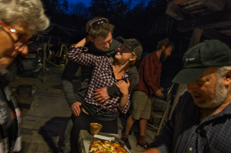 Josh and Lena making pizza at the kiln firing, with Paul Gurewitz, Lower Brush Creek, Madison County, NC 2015