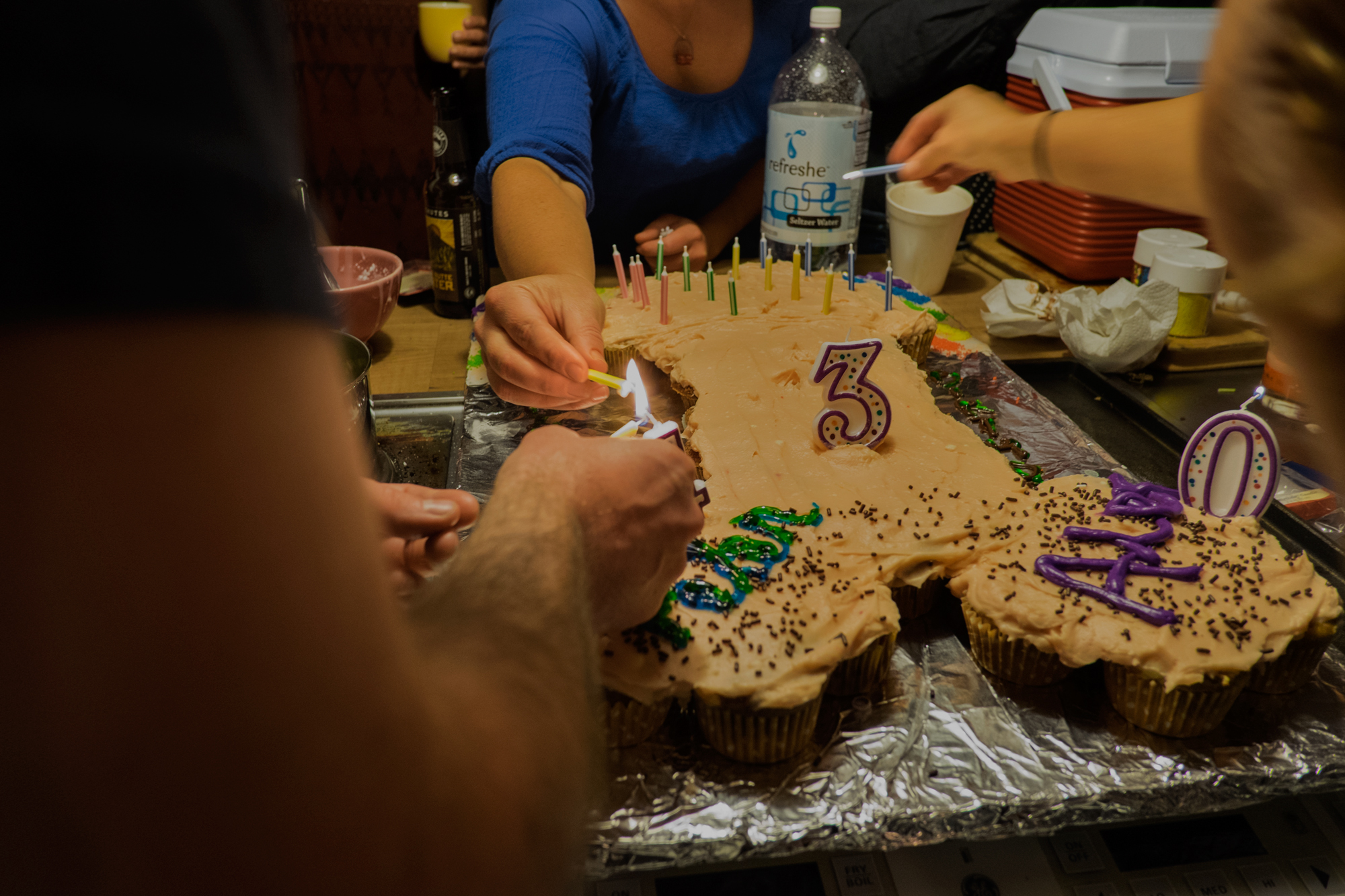Lighting the penis cake, Seattle, Washington, photograph by Stephen Silva using my second camera