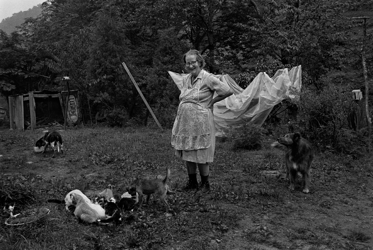 Noted balladeer, Dellie Norton, Feeding Her Pets, Sodom, Madison County, NC 1975