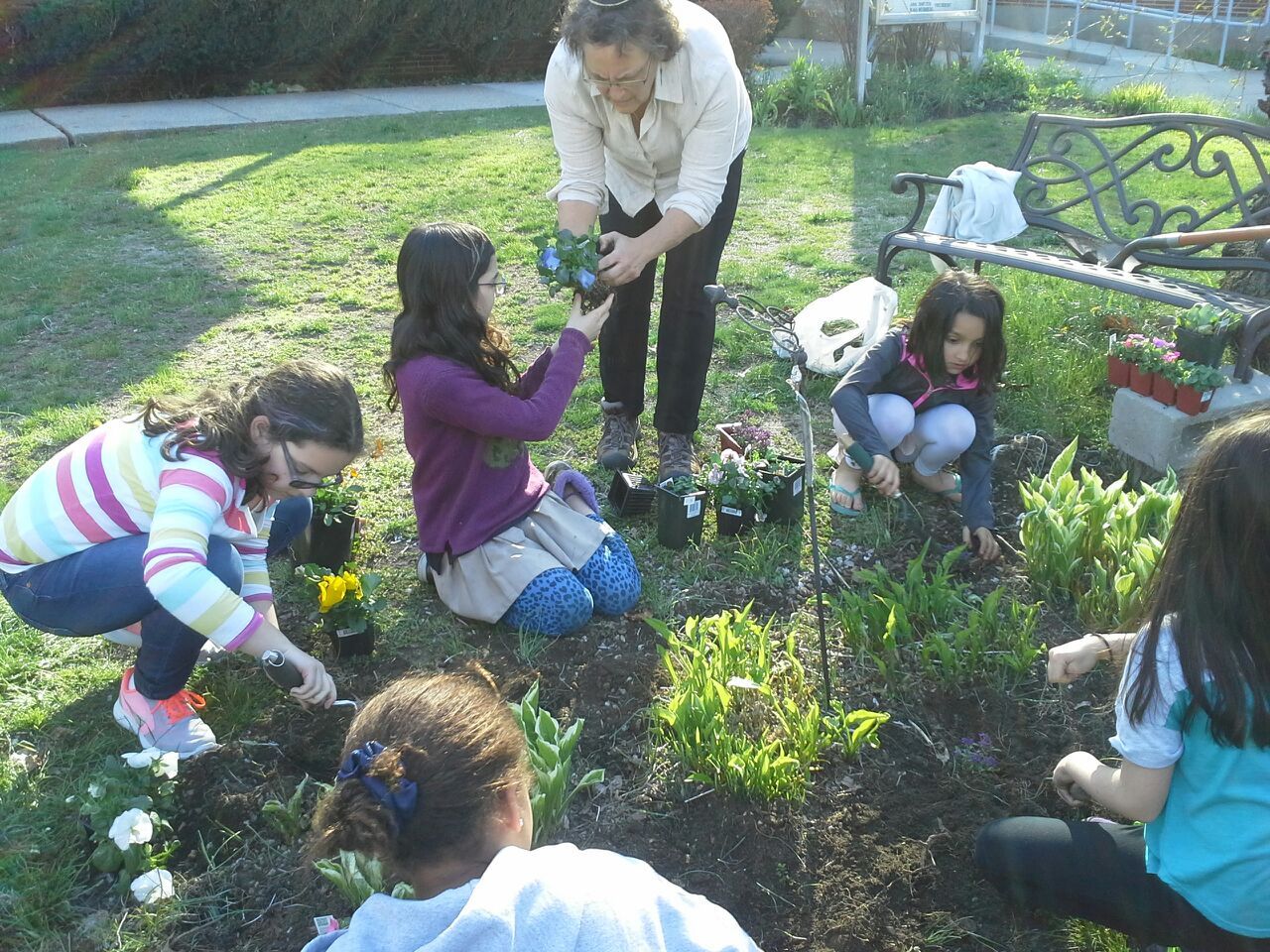 electives april tracy with girls planting.jpg