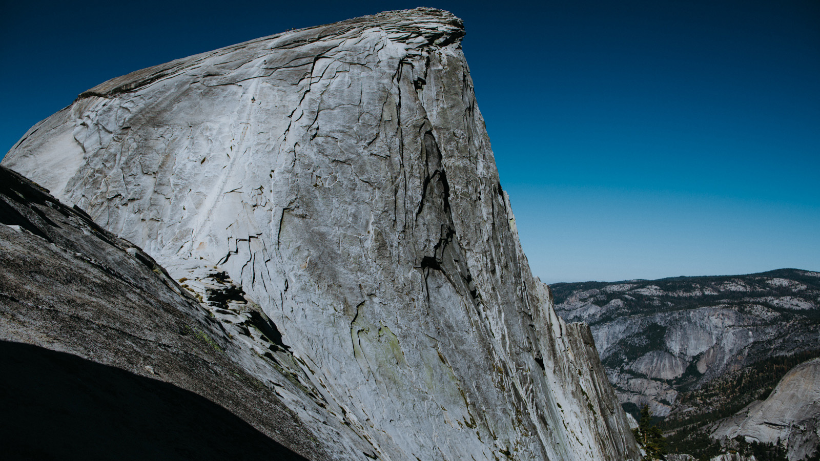 A couple of days later, an early rise and a brisk morning hike brings us to the base of Yosemite’s iconic Half Dome. Some of the first people we have seen in days are barely visible on the Cable Route heading up the bleached stripe on the east side of the dome.