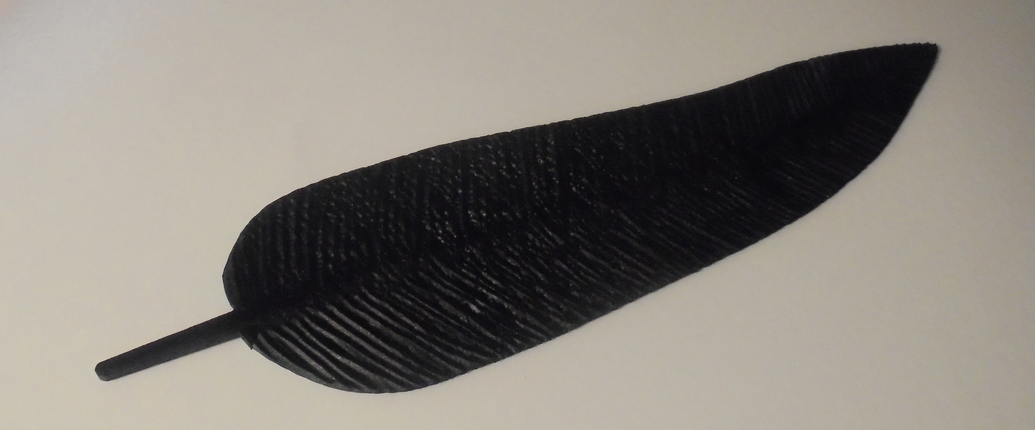 Highly detailed feather printed on the Objet30 Pro and dyed in black.