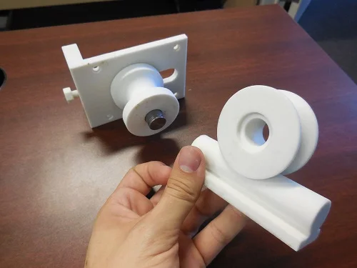 3D printed prototype of a plastic roller to test function and fit.
