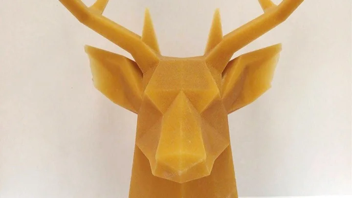 A 3D printed plastic model stag head made with large format printing.