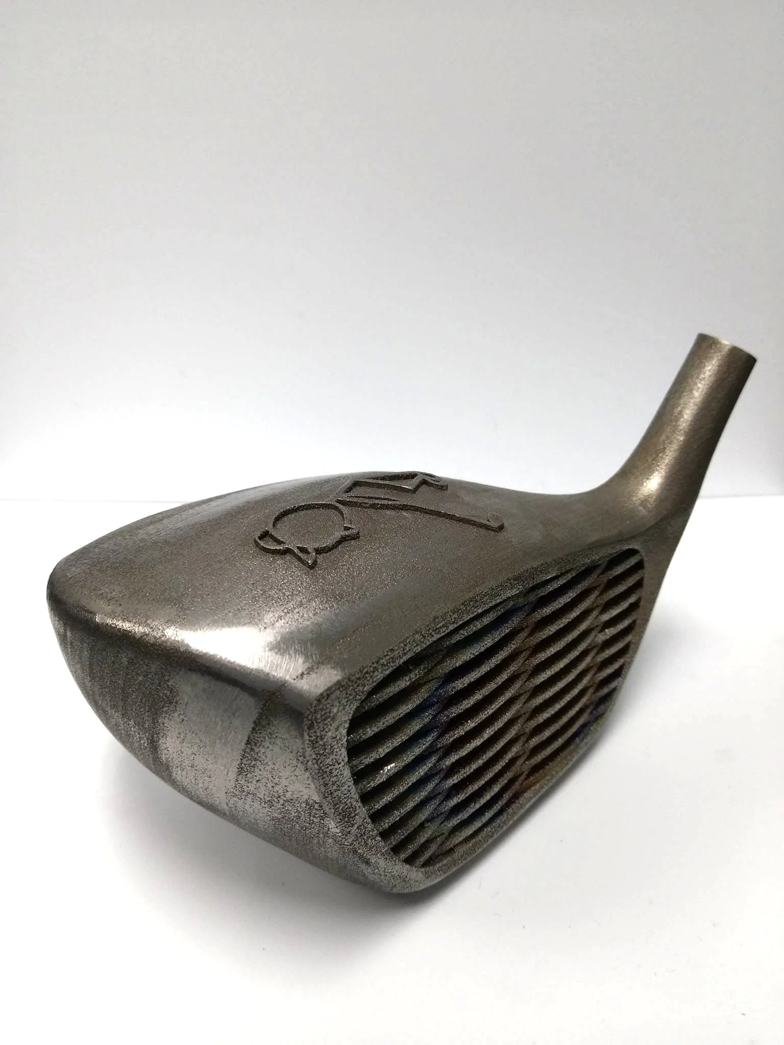 3D printed titanium golf club made with DMLS.
