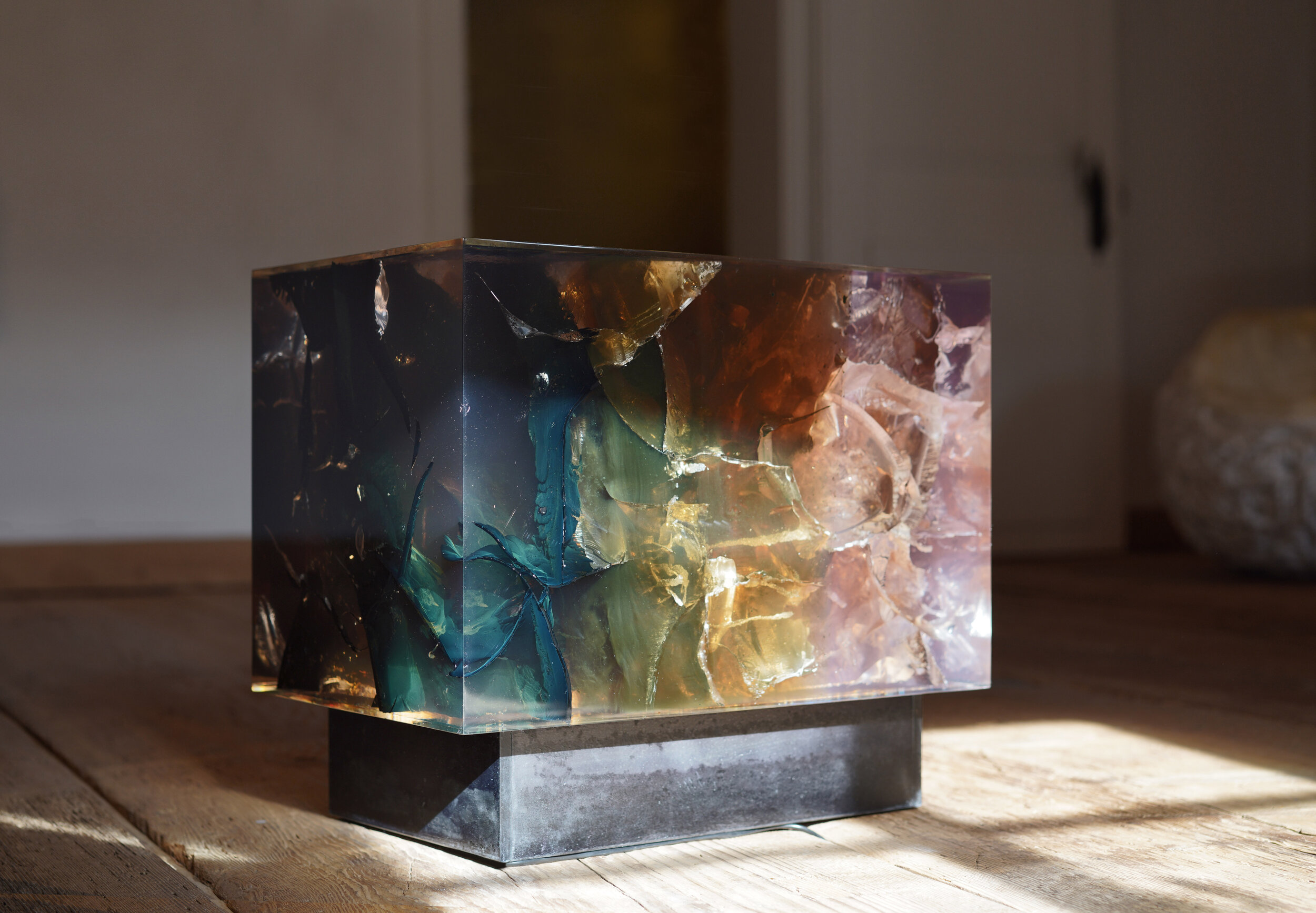  Sculptural block and bench by Tom Price. Resin, tar, steel, lighting 