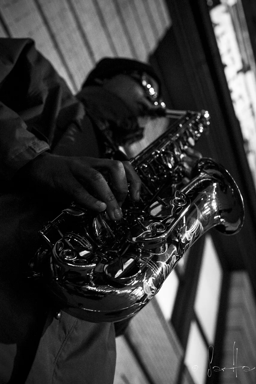  A lone saxophonist on the streets of NY played under the Marshall's sign on 18th St.&nbsp; 