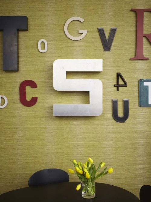 Kid-Friendly wallpaper with assorted vintage letters that adds interest to the room. (Casey Design/Planning Group Inc. - Photo by Michael Graydon)