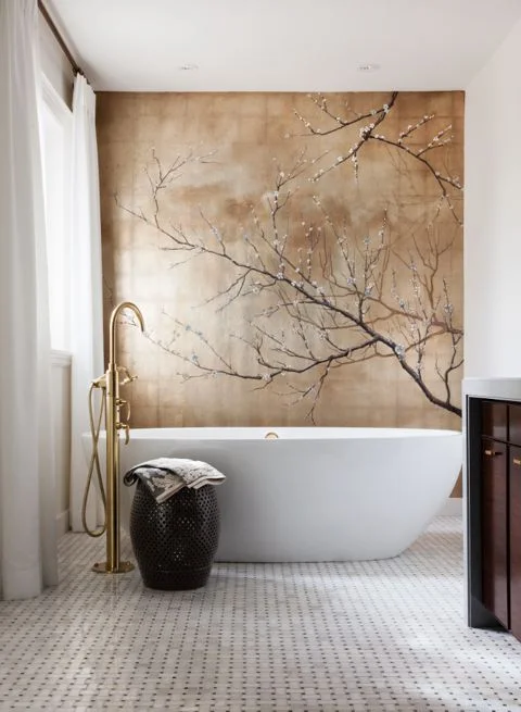 I played off the contemporary brass tub filler with an Asian inspired mural of cherry blossoms to create a zen peaceful ensuite for a young chic couple. (Casey Design/Planning Group Inc. - Photo by Donna Griffith)