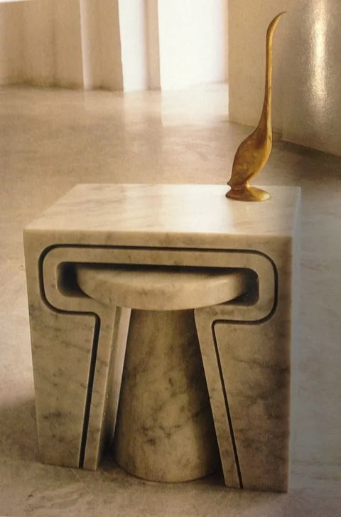 Marble nesting table by Jim Hannon-Tan. in the Jan 2013 issue of World of Interiors. I love the mix of materials here and the scale: solid, parchment coloured tables with the brass long necked bird. Their inherent qualities are so opposite that their differences makes them look better when seen together. ( World of Interiors )