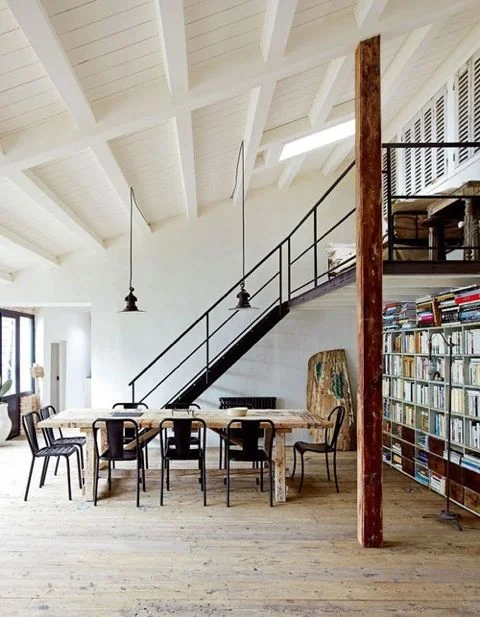 What's not to like about this classic loft with the metal staircase, rows of books and openness. ( Weheartit )