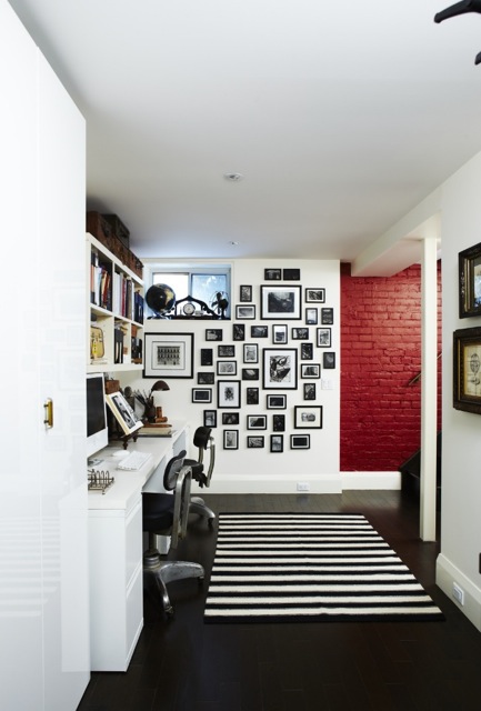 This graphic basement home office featuring striped area rug, collection of black and white drawings to create an airy yet interesting work space. (Casey Design/Planning Group Inc. - Photo by Angus Fergusson)