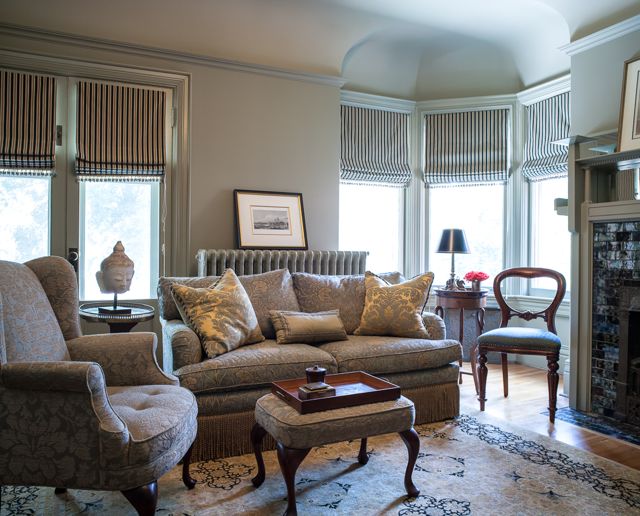 This traditional study has a soft, light-green palette and the striped draperies create a graphic yet warm quality (Casey Design/Planning Group Inc. - Photo by Ted Yarwood).