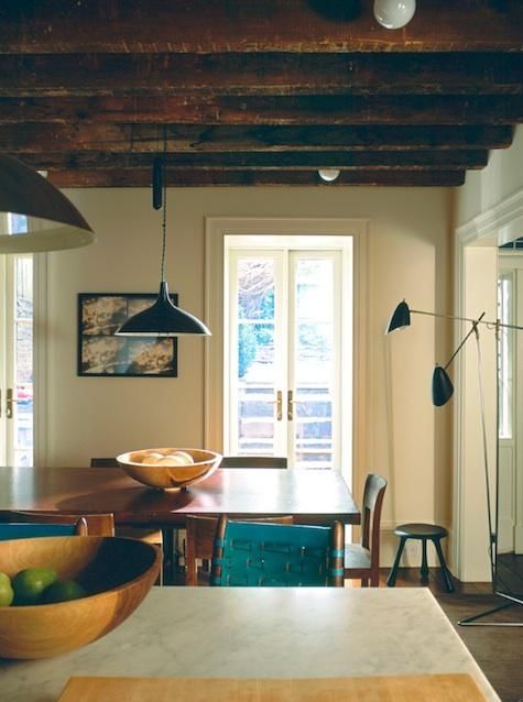 We love the subtle touches of indigo in this neutral kitchen. It beautifully complements the natural wood tones in the space. ( Remodelista ).