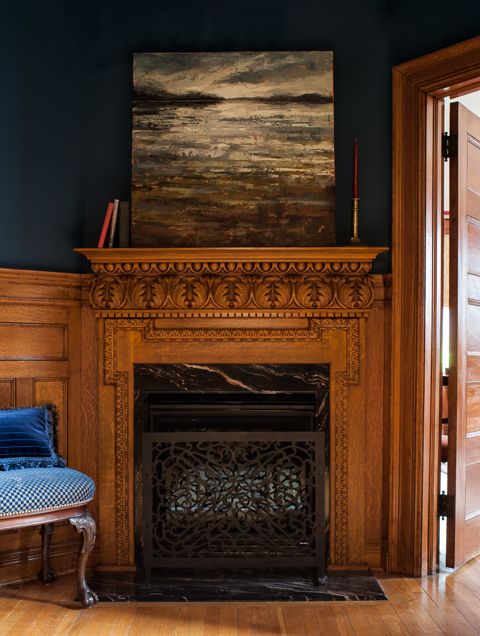 The rich hues of the indigo walls and the hand-carved, white oak mantle creates a foyer that looks like its been here for a hundred years. One of our favourite historical renovation projects. (Casey Design/Planning Group Inc. - Photos by Ted Yarwood).