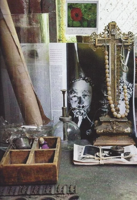 The walls and tables are adorned with found objects and inspirational images from Theresa's eclectic collections.