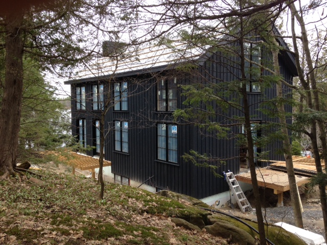 On the exterior, we utilized simple forms and a colour palette that complements the surrounding environment. (Casey Design/Planning Group Inc.)